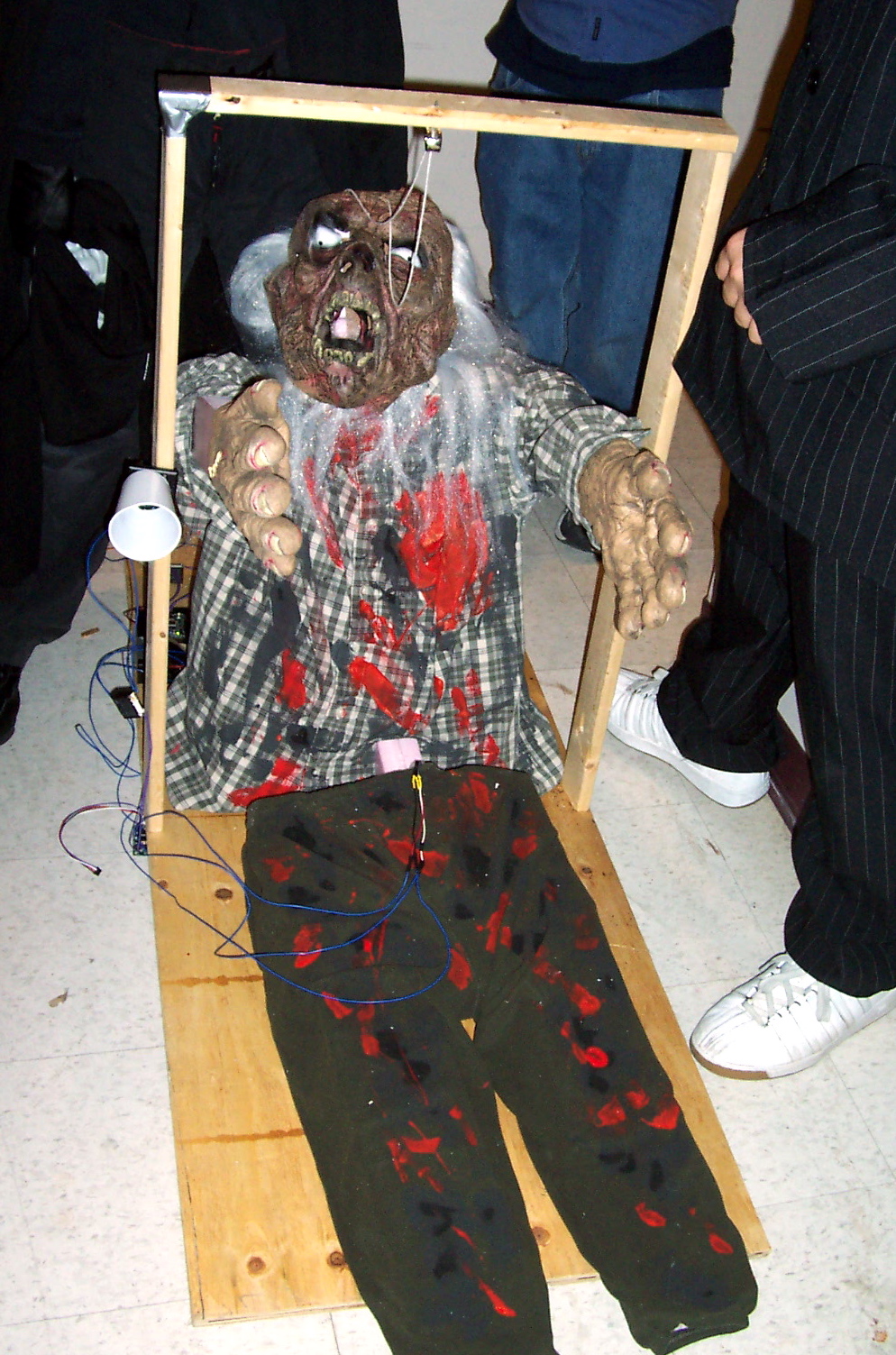 photo of a life-size animatronic zombie installation